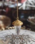 Detailed view of Inner Oracle pendulum featuring moon, sun and stars