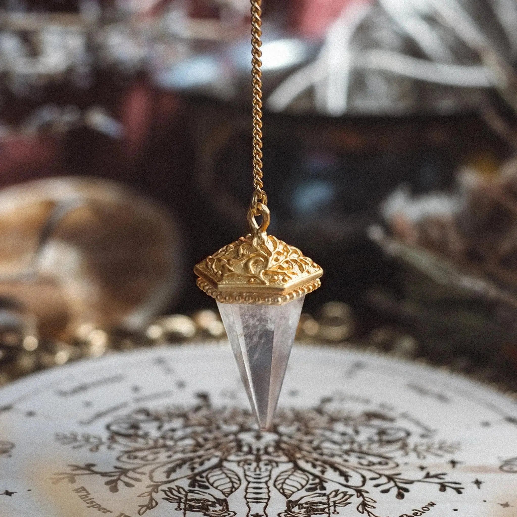 Detailed view of Inner Oracle pendulum featuring moon, sun and stars